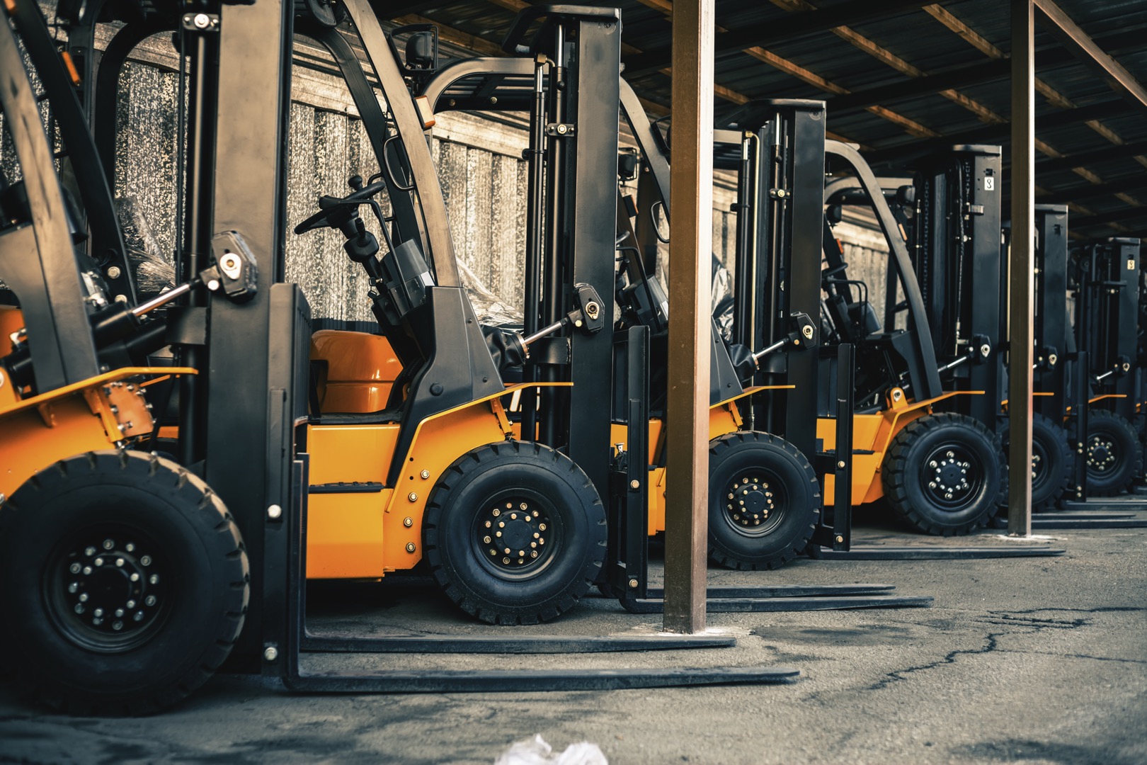 Background of a lot of forklifts, reliable heavy loader, truck. Heavy duty equipment, forklift; Shutterstock ID 1054248686; purchase_order: -; job: -; client: -; other: -