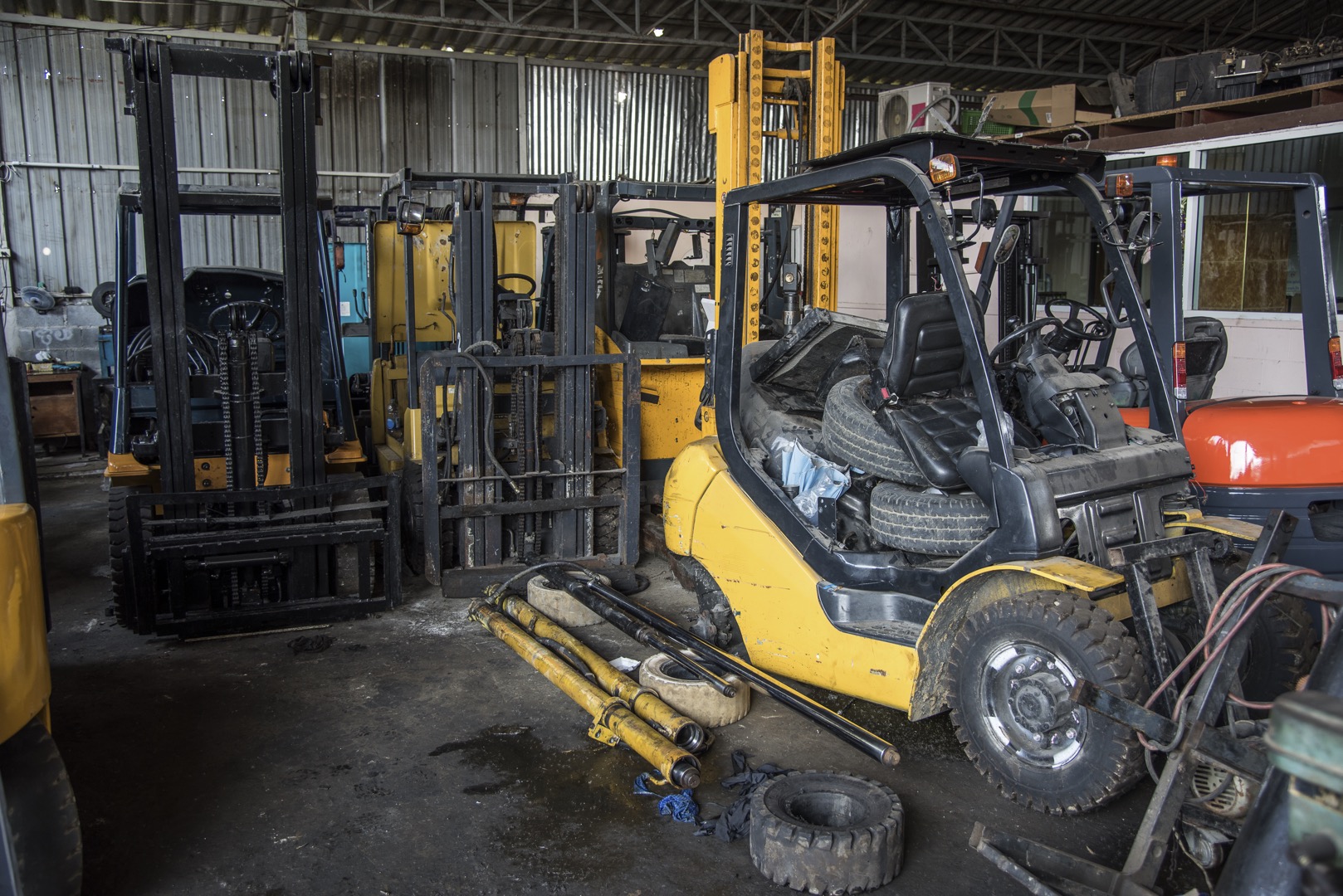 Forklift garage with parts ; Shutterstock ID 426358894; purchase_order: -; job: -; client: -; other: -